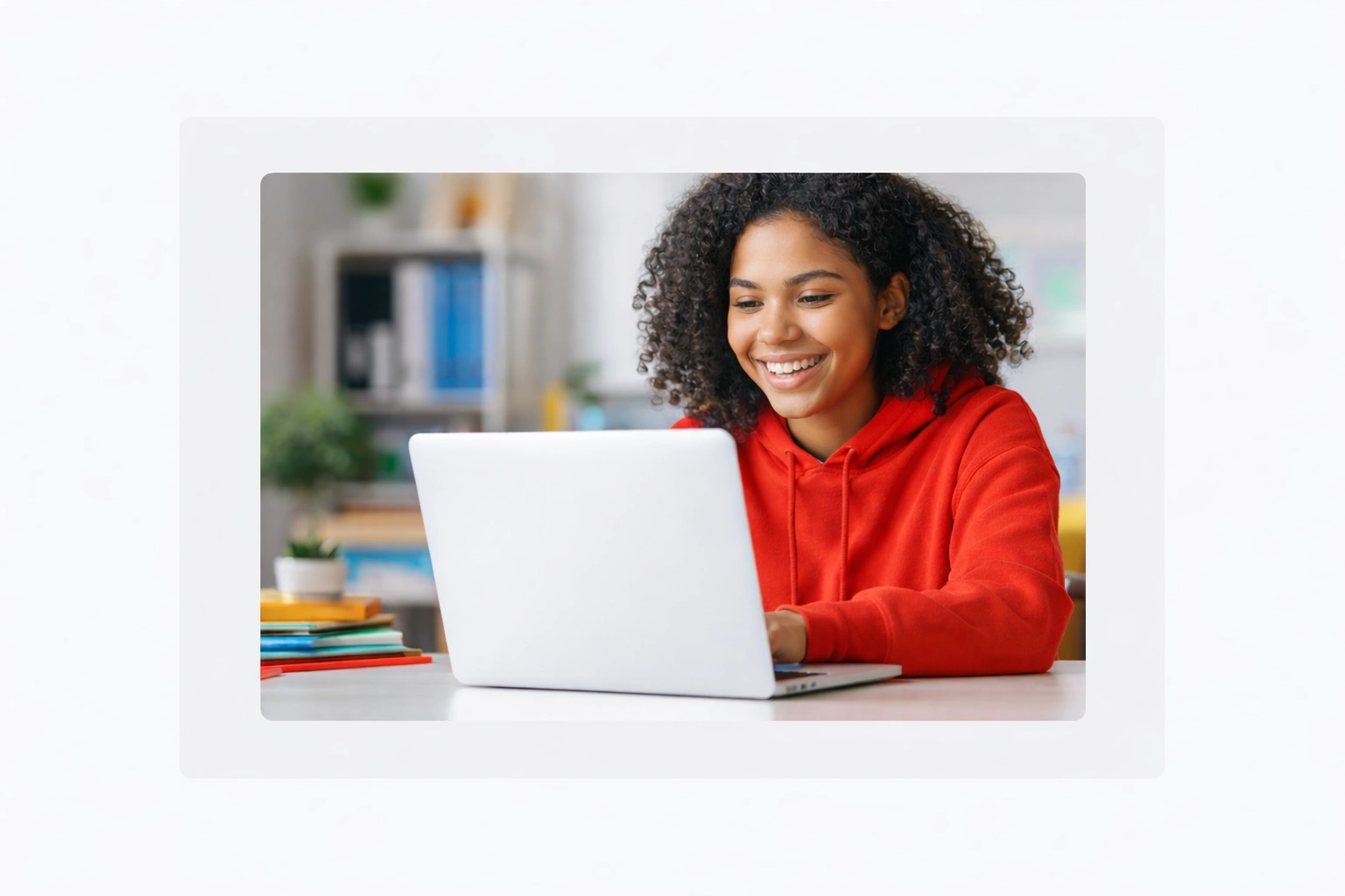 Happy student with a free government laptop